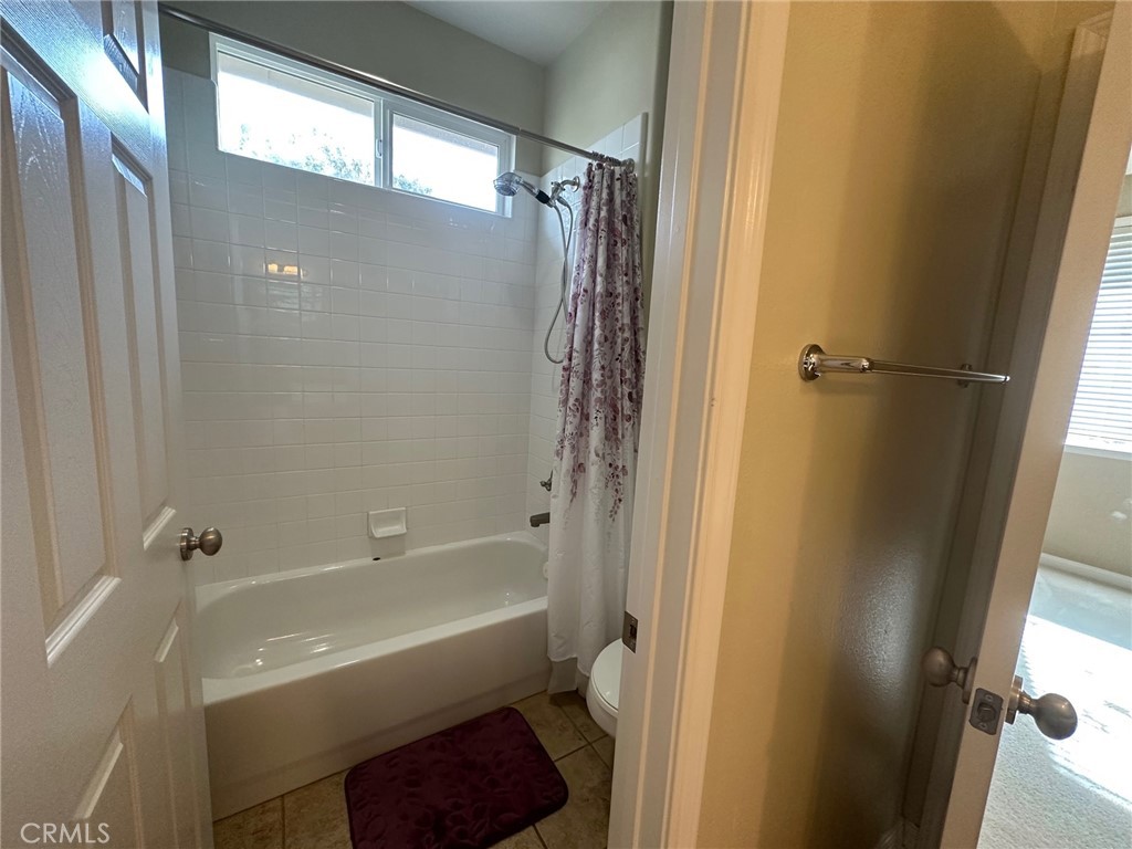 5588 California Oak Street Simi Valley, CA 93063 - Photo 27 of 38 a bathroom with a shower a sink and a toilet