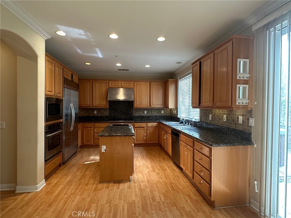 5588 California Oak Street Simi Valley, CA 93063 - Photo 6 of 38 a kitchen with stainless steel appliances granite countertop a stove a sink and a refrigerator