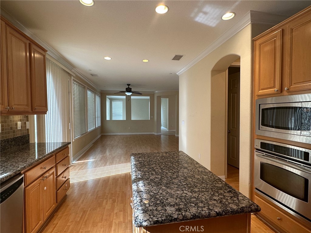 5588 California Oak Street Simi Valley, CA 93063 - Photo 10 of 38 a view of a kitchen with stainless steel appliances granite countertop a refrigerator and a stove top oven