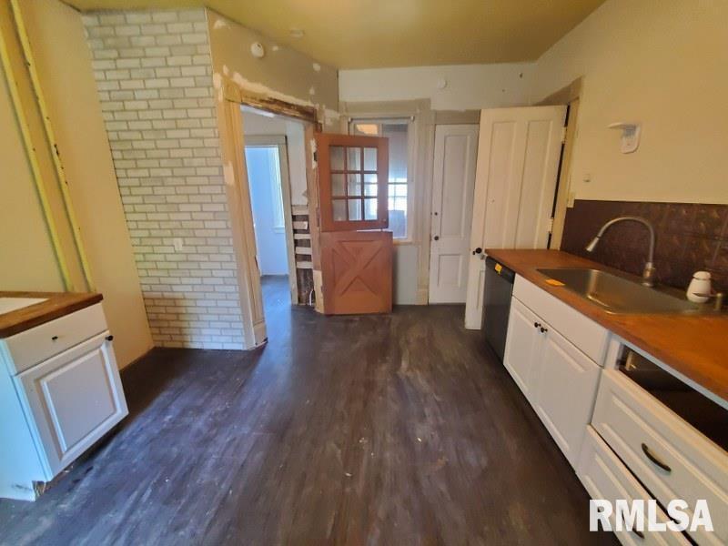 1043 19th Street Rock Island, IL 61201 - Photo 8 of 13 a view of a kitchen with wooden floor and electronic appliances