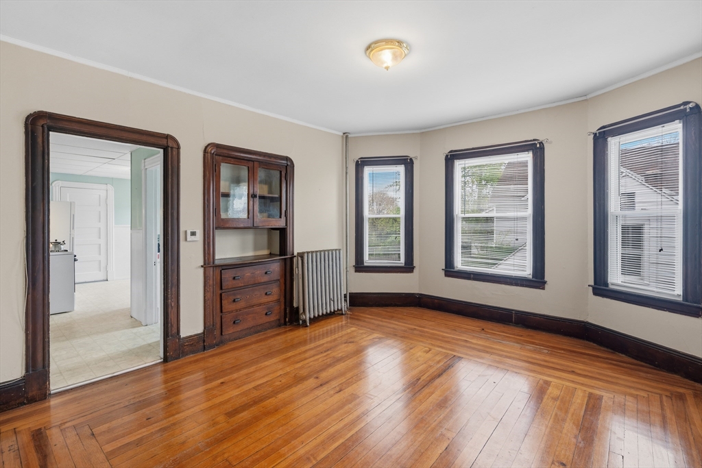 43 Elmdale Street, Unit 2 West Springfield, MA 01089 - Photo 6 of 14 wooden floor in an empty room with a window