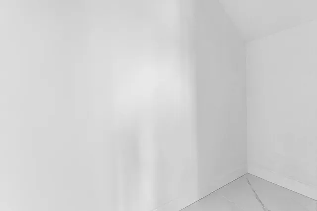 a close up of a white marble wall