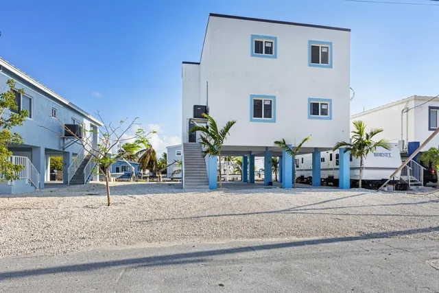 a swimming pool with outdoor seating and yard