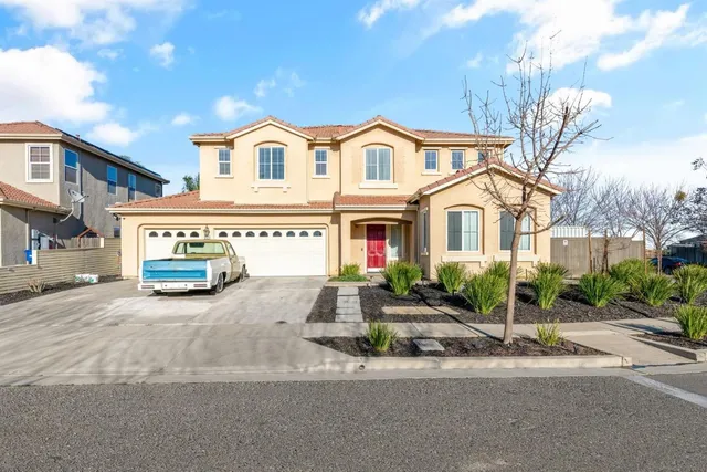 a view of multiple houses with a street