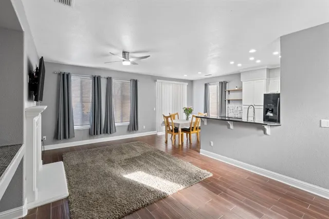 a view of a livingroom with furniture and a window