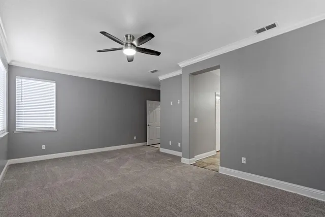 a view of an empty room with a window