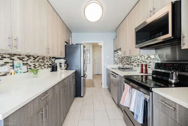 a bedroom with a bed and large window