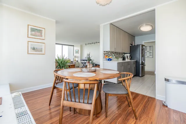 a kitchen with stainless steel appliances a stove a sink and a refrigerator