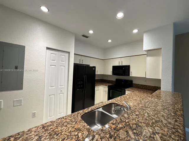 a bedroom with a bed and television