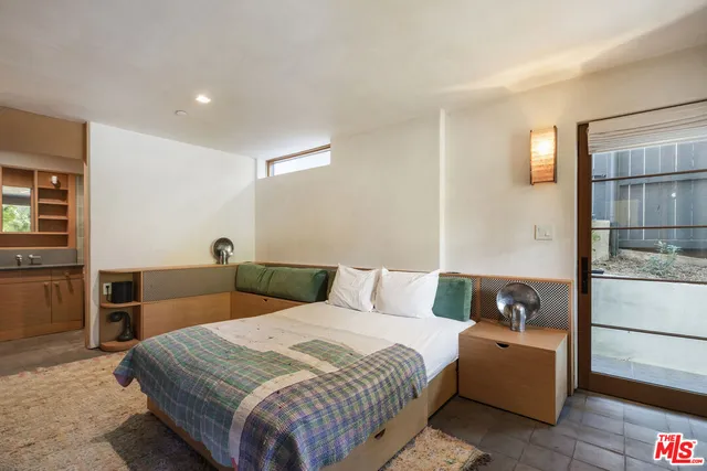 a living room with a couch and a large window