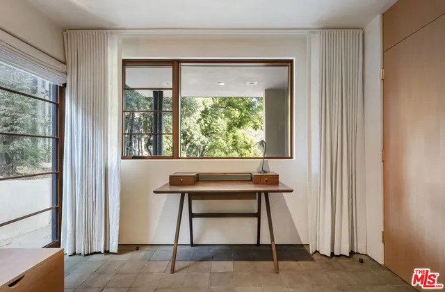 a bedroom with furniture and a bed