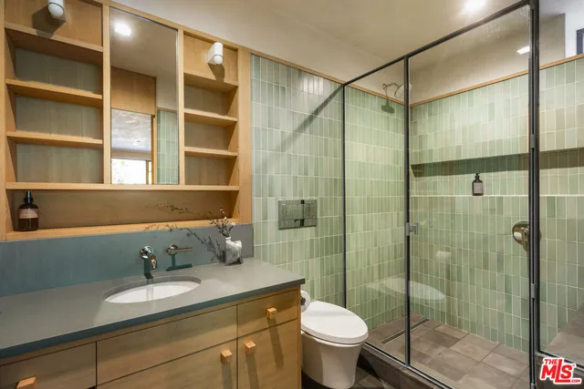 a view of a pathway of a house with backyard and wooden floor