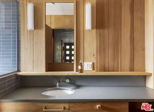 a living room with a table and a fireplace