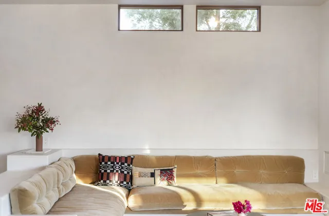 a room with a large window and a table