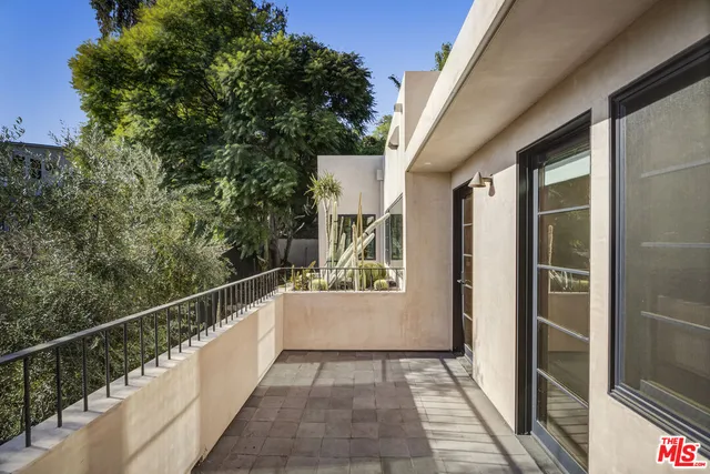 a bathroom with a sink double vanity and a mirror