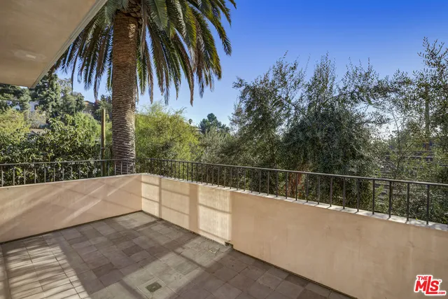a bathroom with a granite countertop shower mirror and a sink