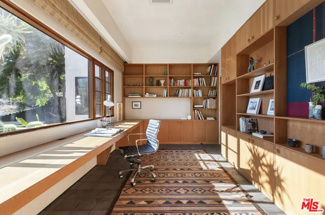 a bathroom with a tub and shower