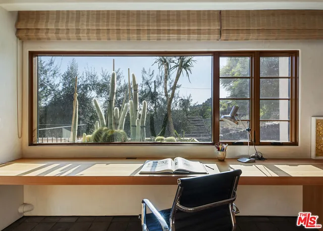 a kitchen with stainless steel appliances granite countertop a sink a stove and a wooden floors