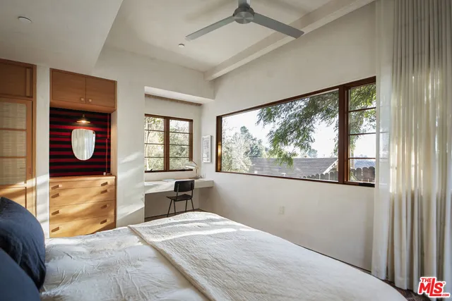 a kitchen with a window cabinets and stainless steel appliances