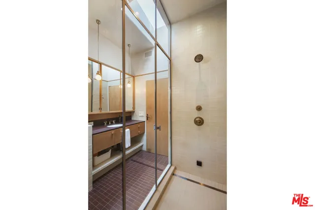 a view of a backyard with plants and outdoor seating