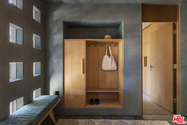 a bedroom with bed and window