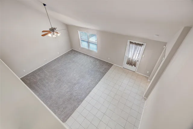 a view of empty room with windows