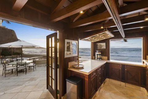 a living room with fireplace furniture and a chandelier