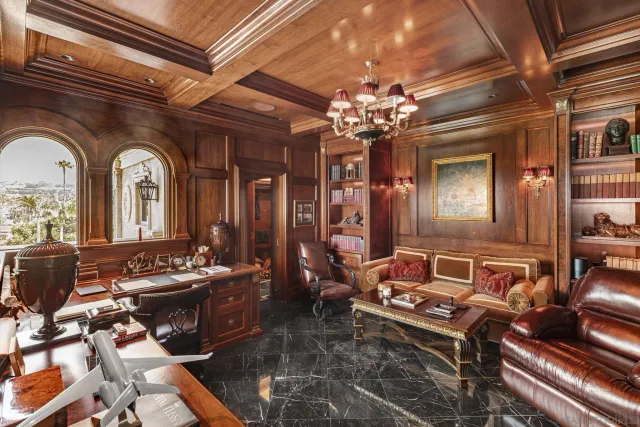 a view of a white building with a outdoor space