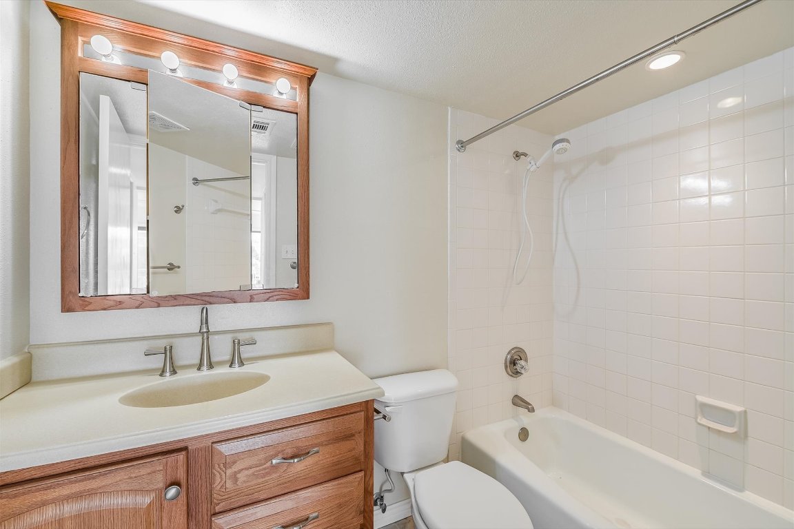 2918 Ranch Road 620 North, Unit B112 Austin, TX 78734 - Photo 8 of 10 Full bathroom with toilet, shower / washtub combination, and vanity
