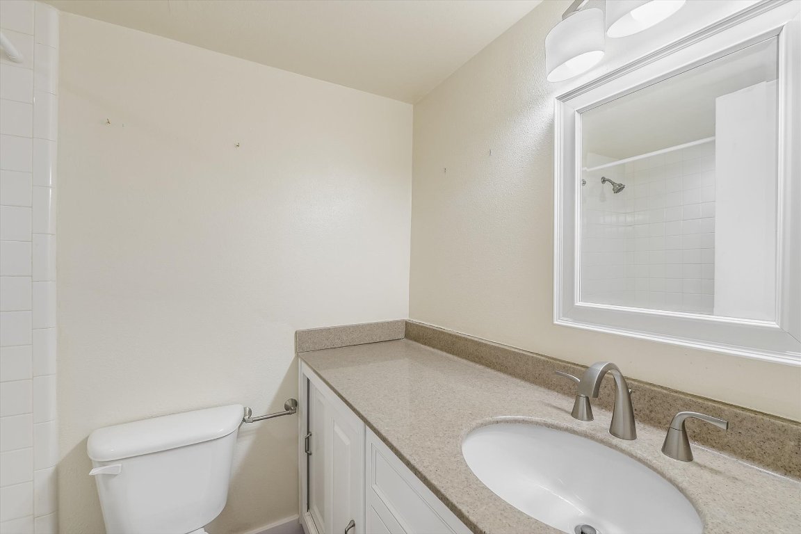 2918 Ranch Road 620 North, Unit B112 Austin, TX 78734 - Photo 10 of 10 Bathroom with toilet, vanity, and a shower