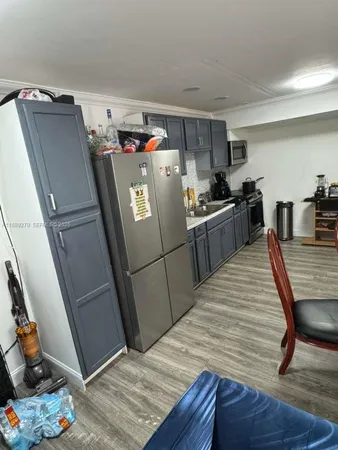 a bedroom with a bed and gym equipment