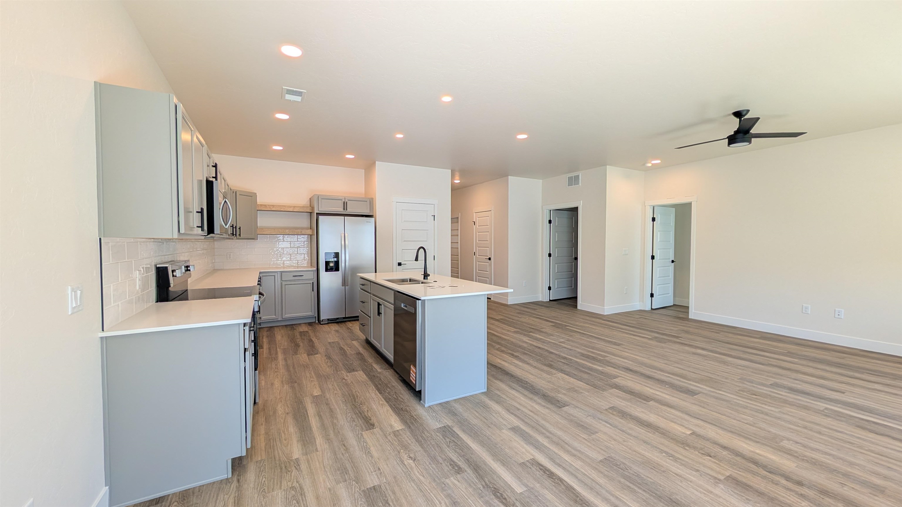 1660 Rusty Rivet Road Fruita, CO 81521 - Photo 5 of 15 a large kitchen with a lot of counter space and stainless steel appliances