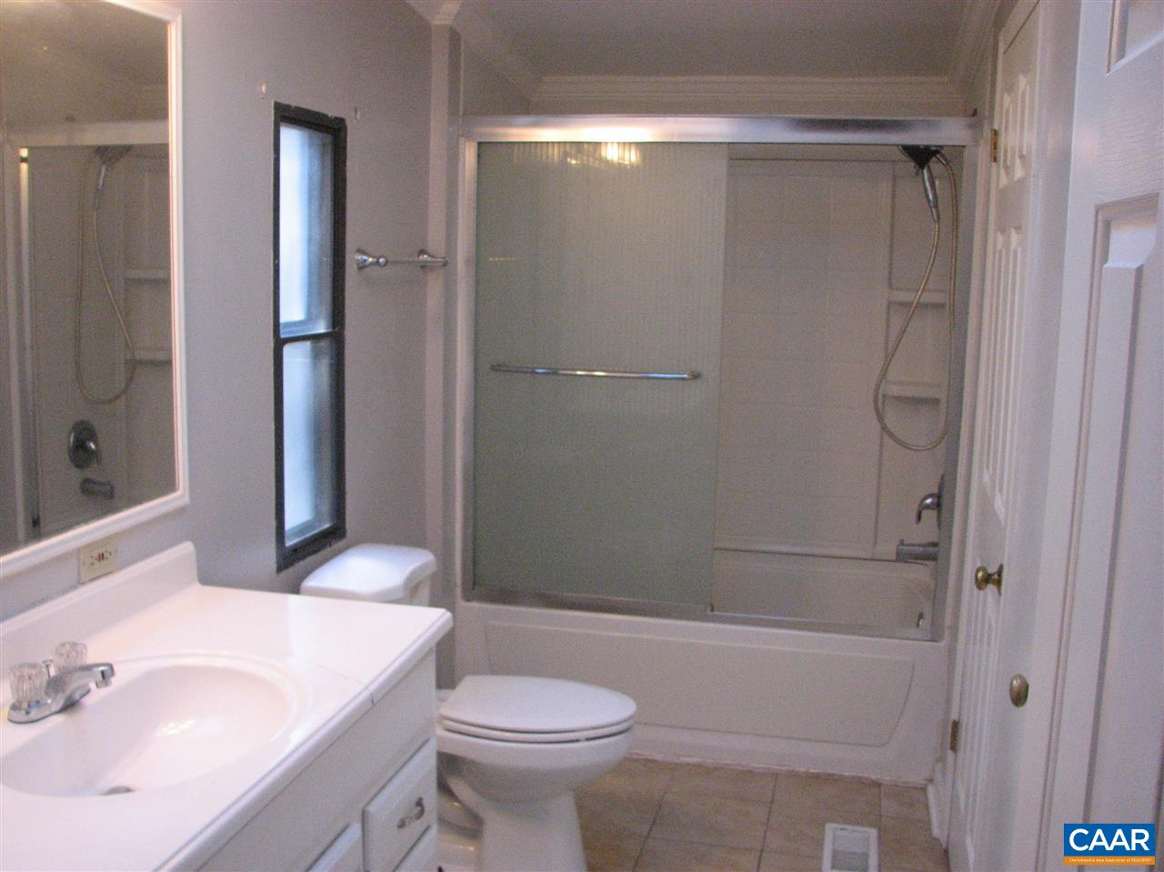 4247 Rising Sun Road Palmyra, VA 22963 - Photo 12 of 31 a bathroom with a sink a toilet and shower