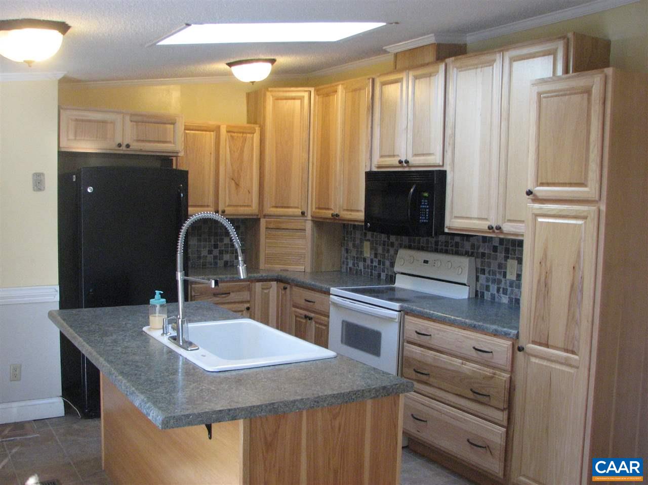 4247 Rising Sun Road Palmyra, VA 22963 - Photo 2 of 31 a kitchen with stainless steel appliances granite countertop a sink stove and refrigerator