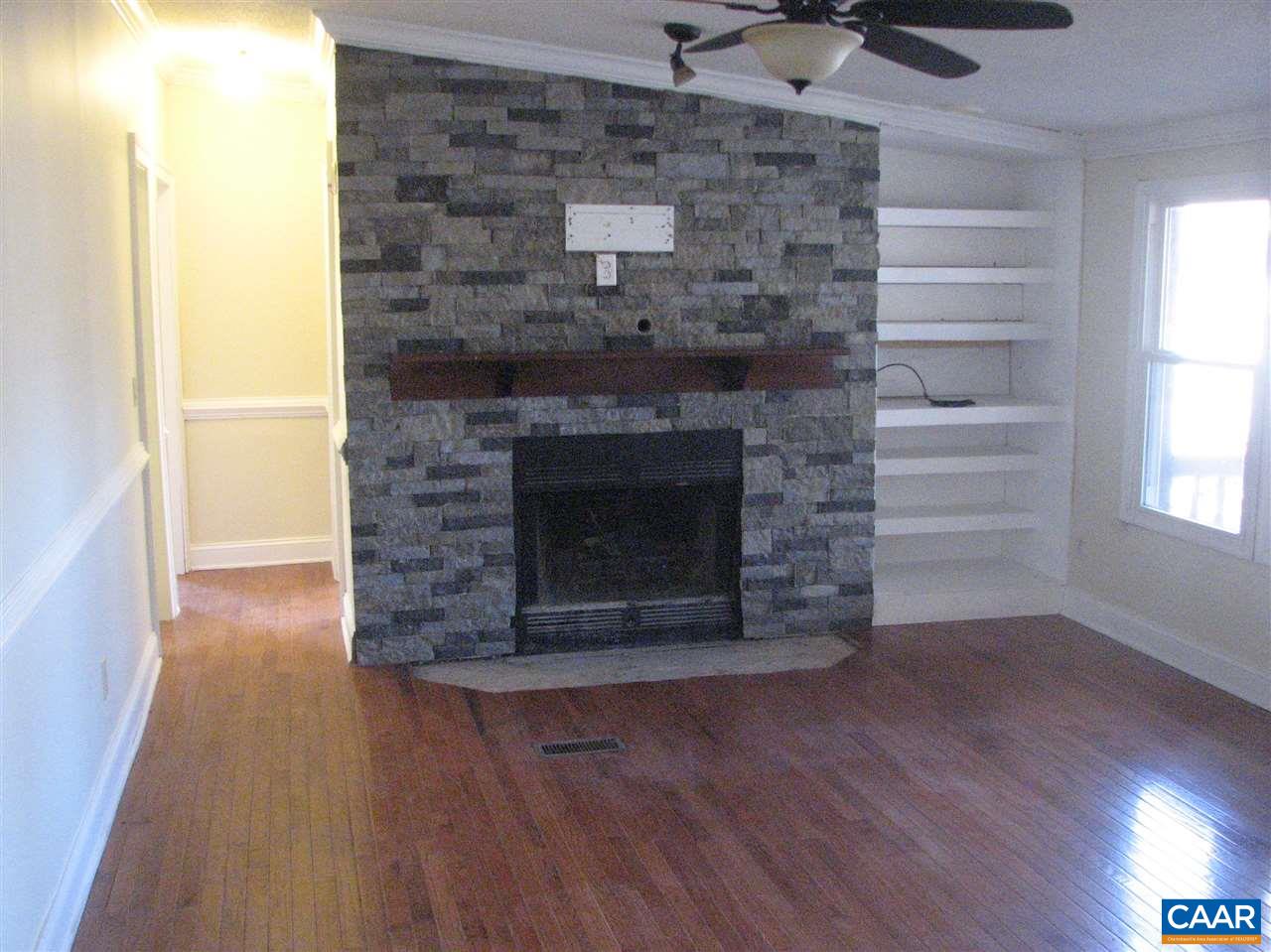 4247 Rising Sun Road Palmyra, VA 22963 - Photo 10 of 31 a room with a fireplace and wooden floor