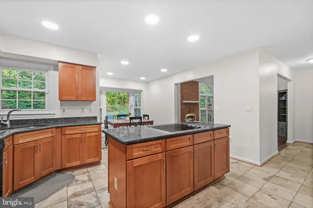 a dining room with furniture and a window