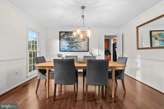 a room with pool table and windows
