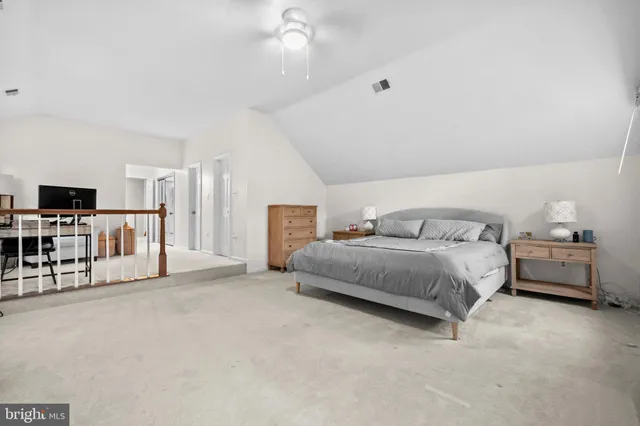 a bathroom with a shower sink and mirror