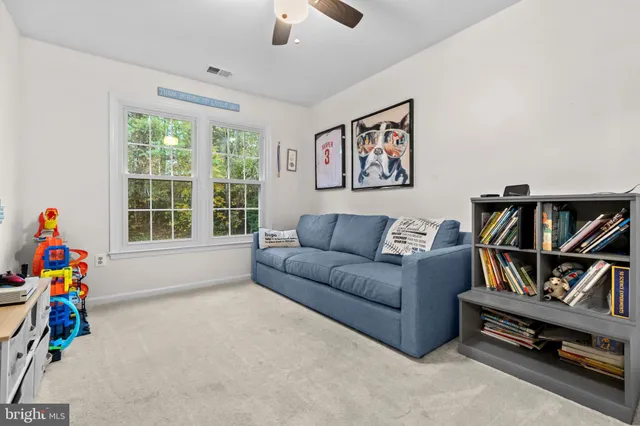 a bedroom with furniture and a baby crib