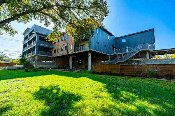 a front view of house with yard and swimming pool