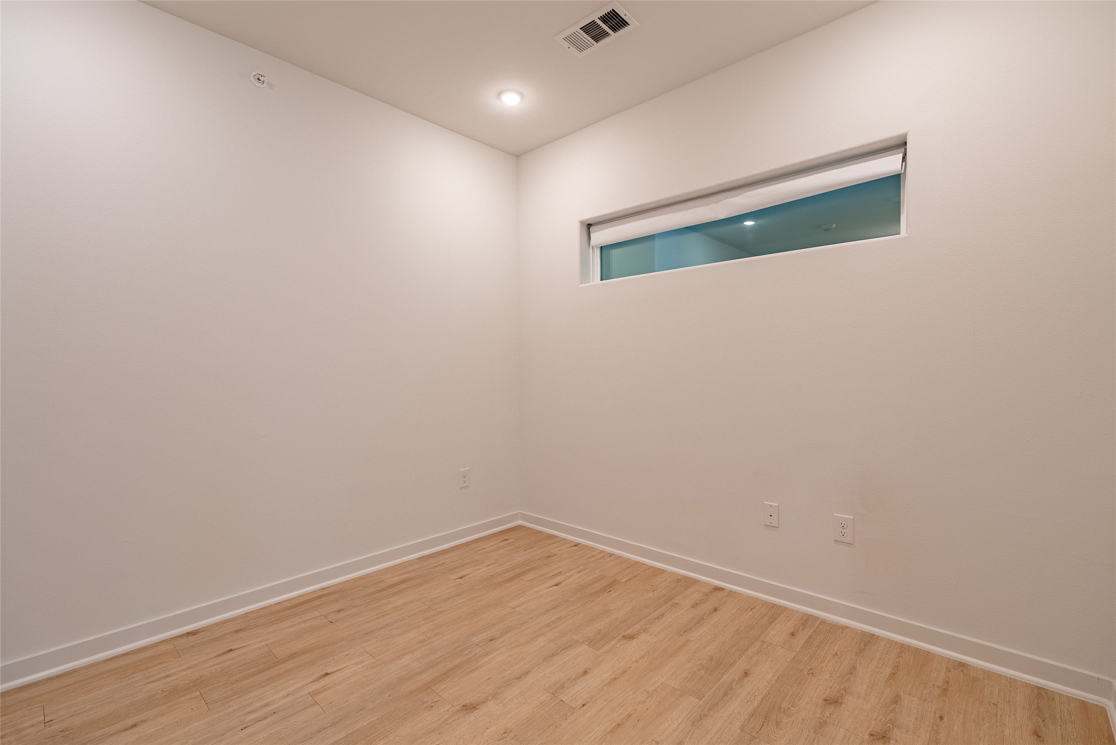 100 West Mockingbird Lane, Unit 201 Austin, TX 78745 - Photo 7 of 16 Spare room with light wood-type flooring and recessed lighting