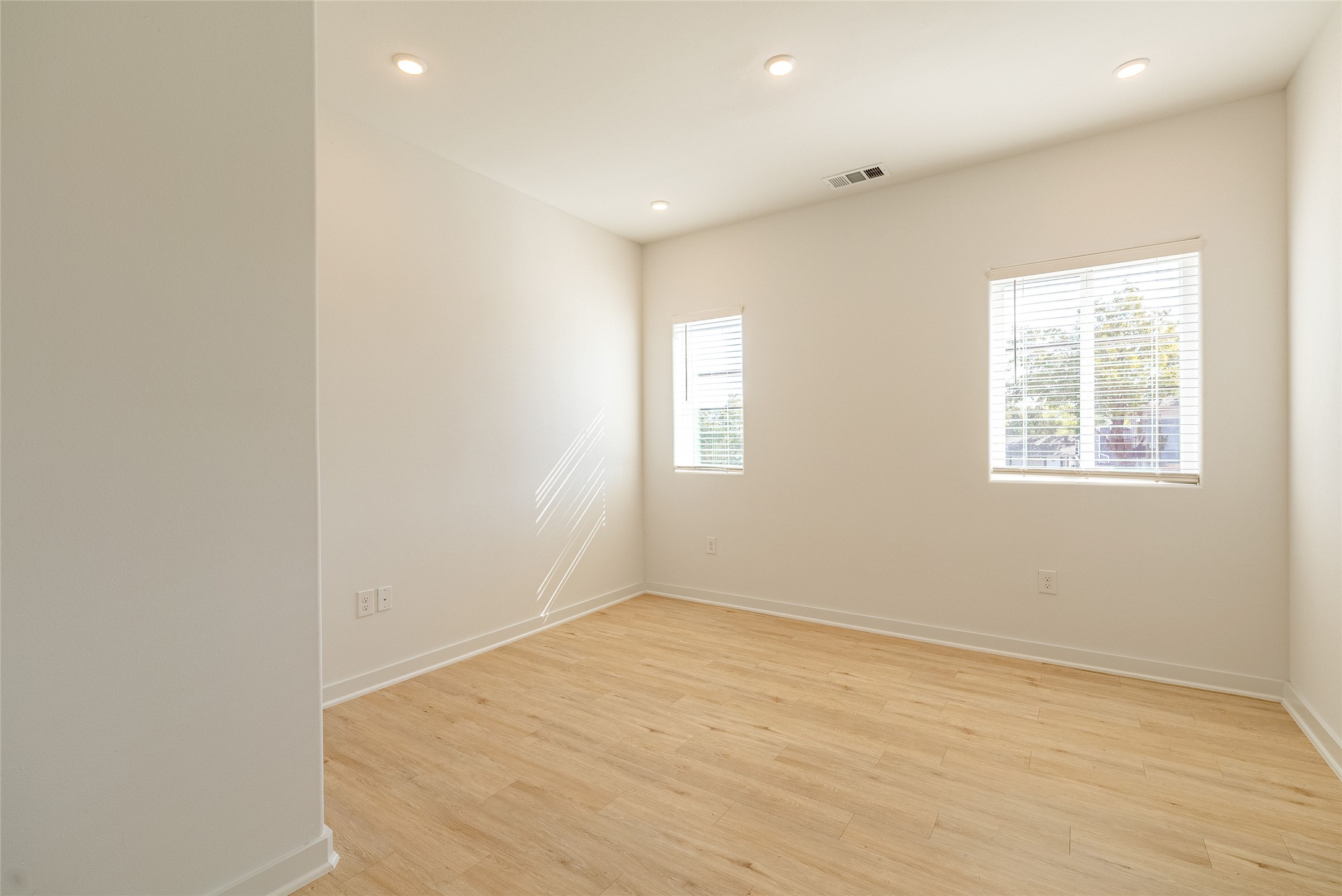 100 West Mockingbird Lane, Unit 201 Austin, TX 78745 - Photo 9 of 16 Unfurnished room featuring recessed lighting and light wood-style flooring