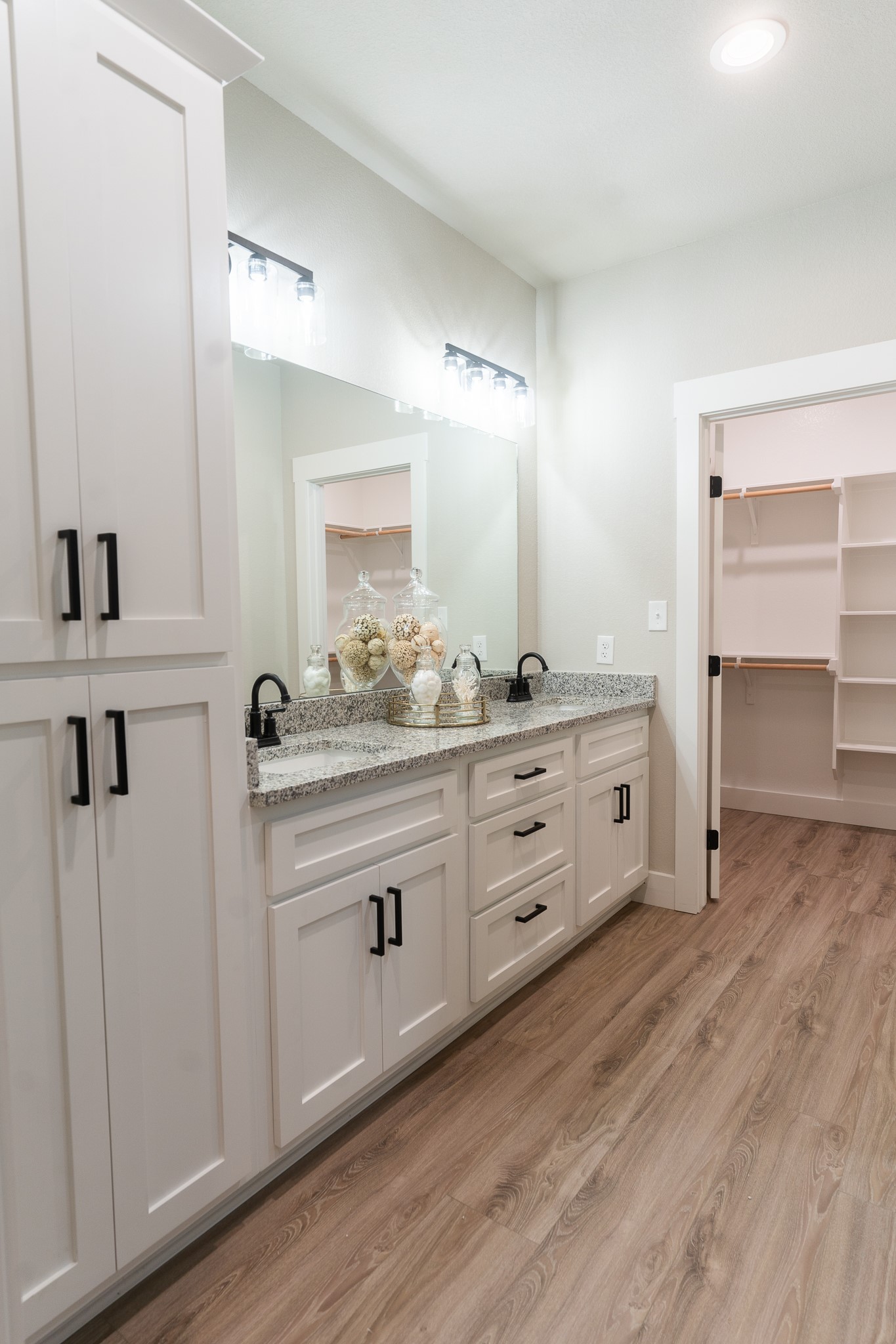307 String Prairie Way Smithville, TX 78957 - Photo 25 of 34 a bathroom with a double vanity sink and mirror