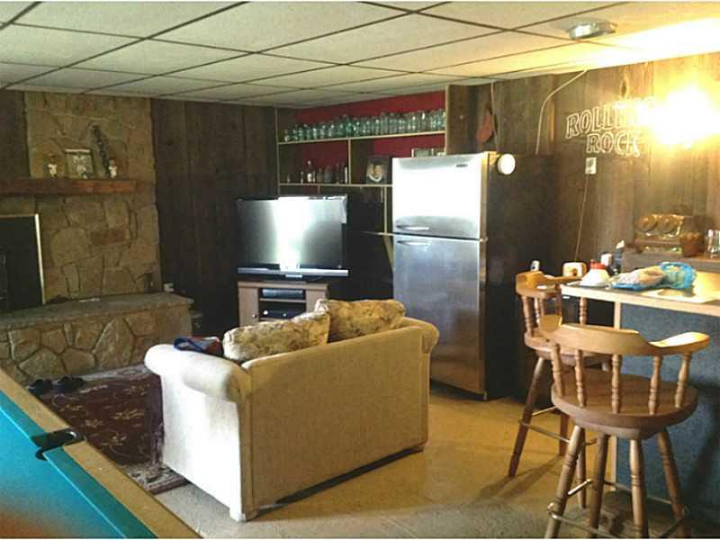 200 McIntyre Road Shelocta, PA 15774 - Photo 4 of 13 Family Room. Bar & fireplace.