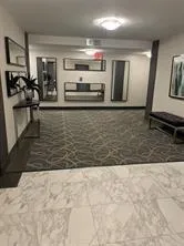 a view of a living room and kitchen