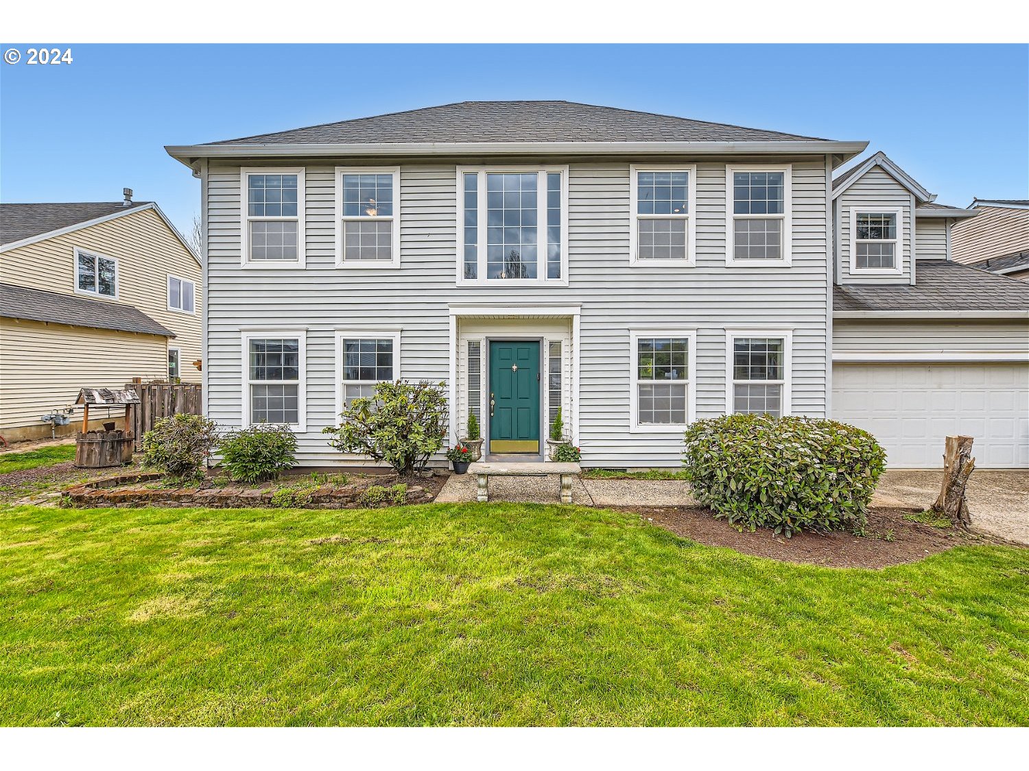 a front view of a house with a yard