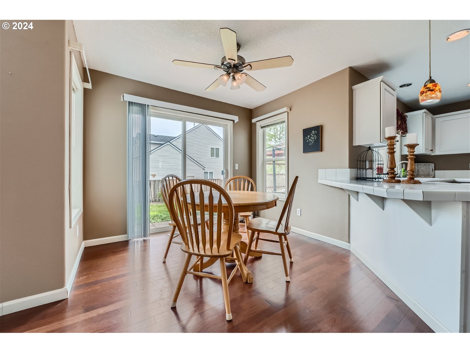 58916 Evergreen Loop St. Helens, OR 97051 - Photo 13 of 28 a view of a dining room with furniture and wooden floor