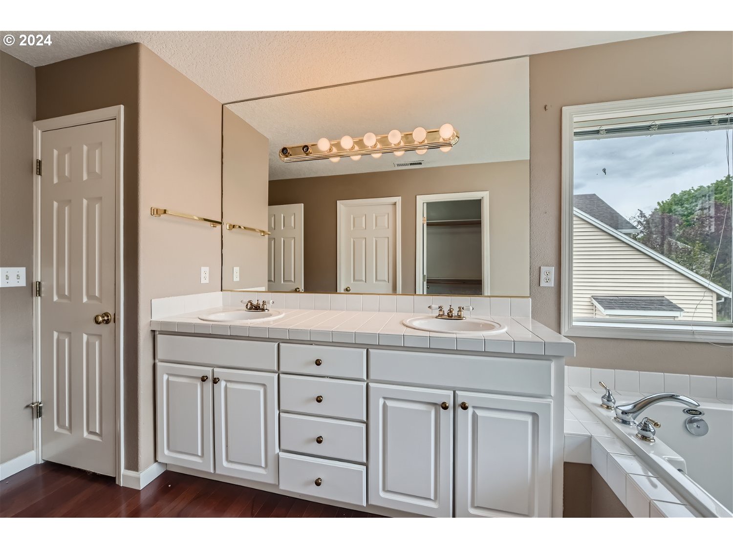 58916 Evergreen Loop St. Helens, OR 97051 - Photo 19 of 28 a bathroom with a sink double vanity and a mirror
