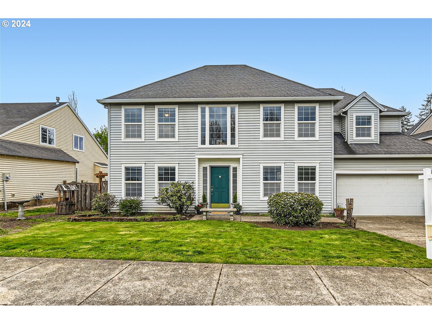 58916 Evergreen Loop St. Helens, OR 97051 - Photo 2 of 28 a front view of a house with a yard and trees