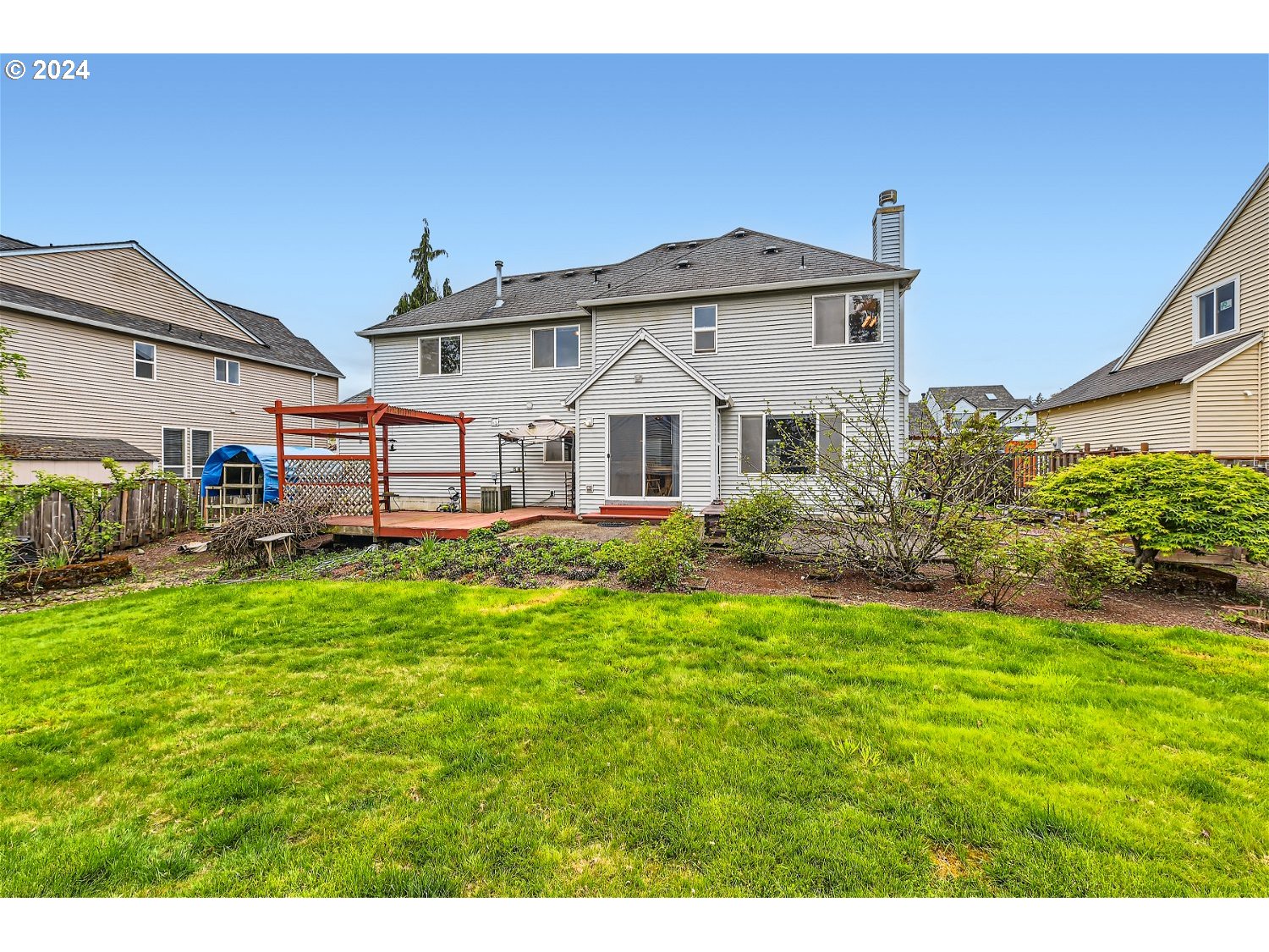 58916 Evergreen Loop St. Helens, OR 97051 - Photo 28 of 28 a front view of a house with a garden and plants